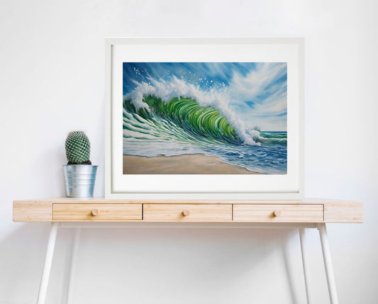 Beach, waves and blue sky art print. framed in white hanging on wall