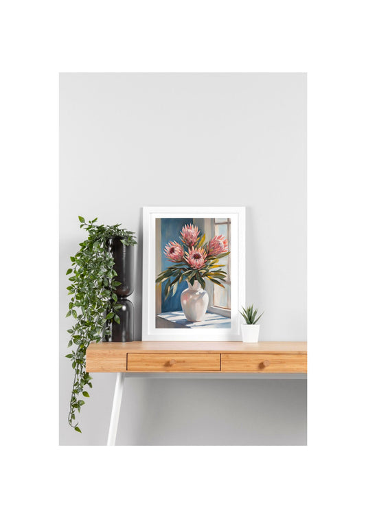 pink proteas flowers in white vase sitting on table near window art print framed in white, sitting on table