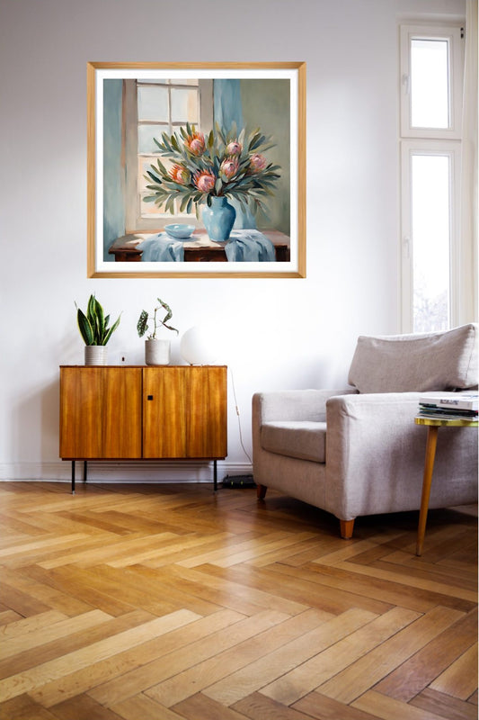 Pink proteas in Blue vase wall art hanging on a wall
