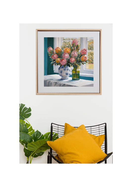 proteas flowers in white and blue vase on table art print hanging on wall.