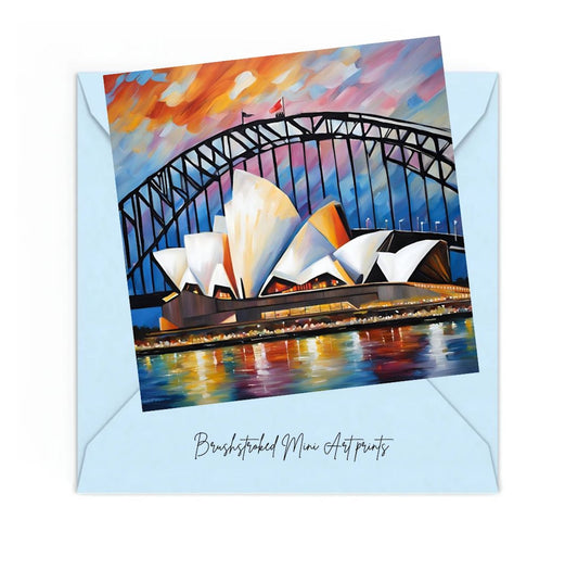 Mini art print of the Sydney Opera House and Harbour Bridge with a colourful brushstroke effect, on a light blue envelope.