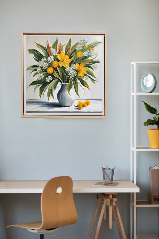 Yellow and white flowers in white vase on table framed art print hung on wall above desk