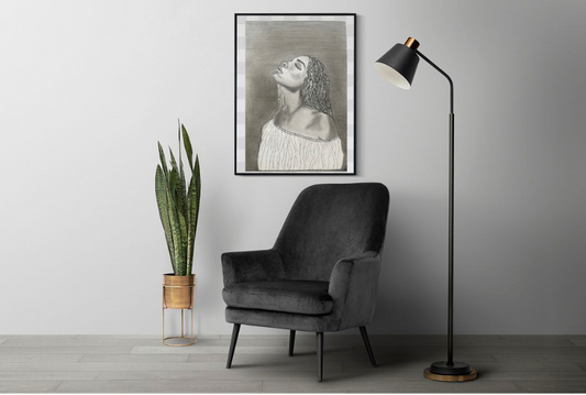 Back and white art print of a woman's portrait framed and hanging on the wall