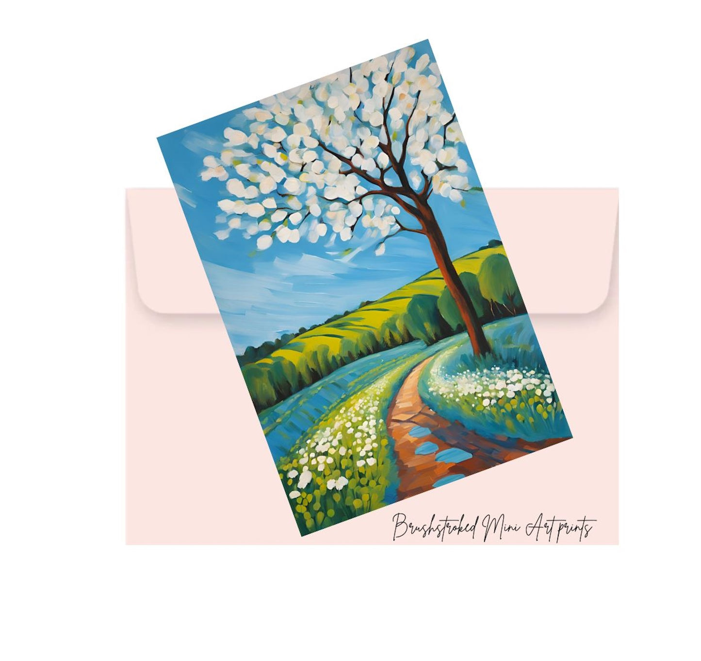 Art print of a scenic landscape with a tree and path on a pink envelope.