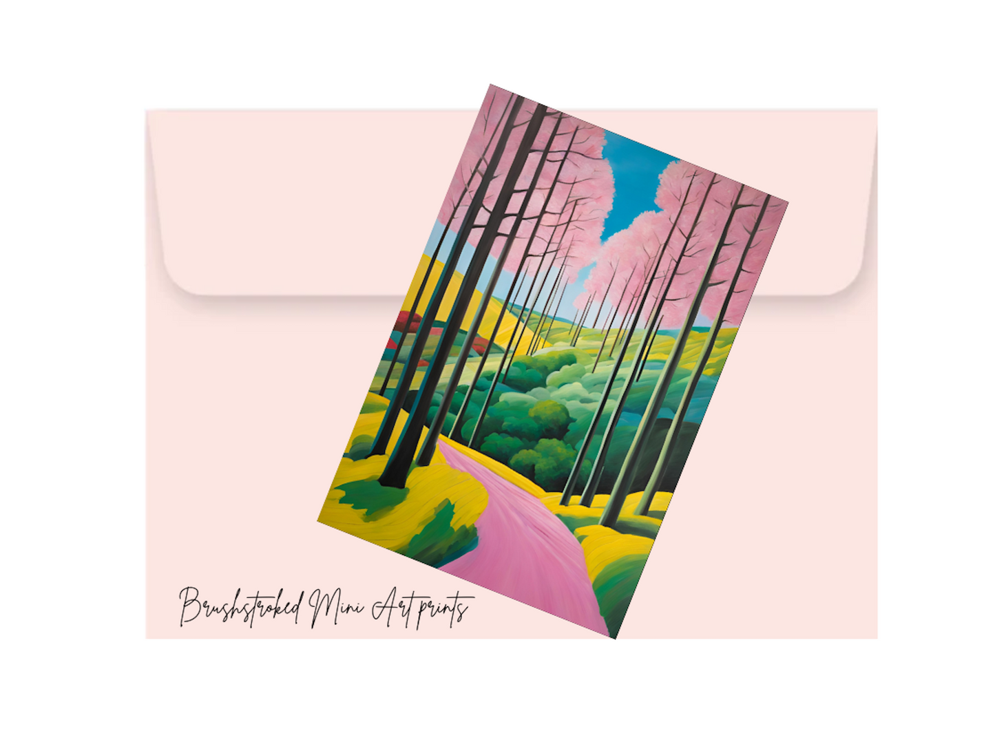 whimsical mini art landscape art nprint on top of a pink envelope