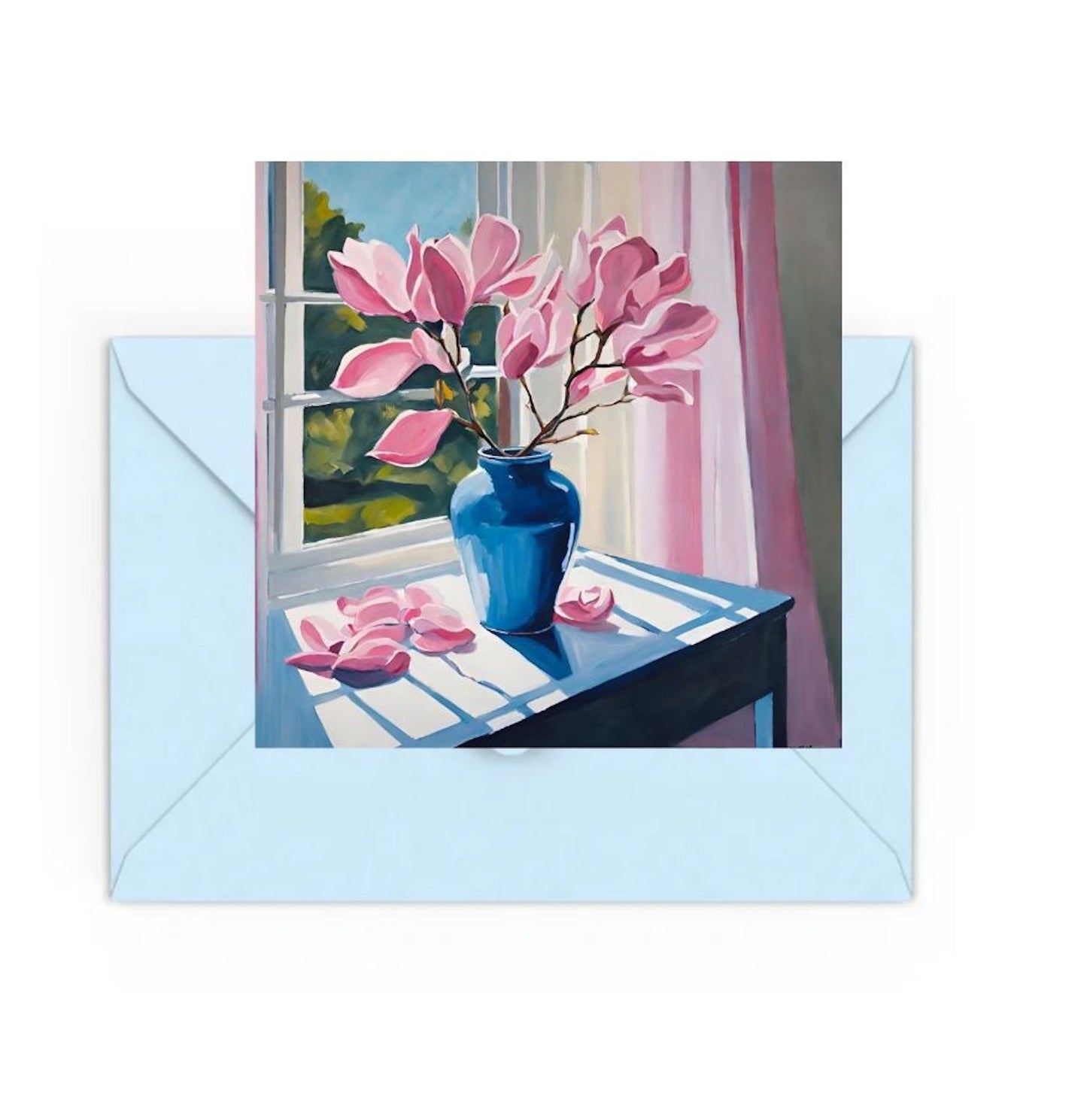 mini art print of pink magnolias in blue vase on table.On top of a Blue envelope.