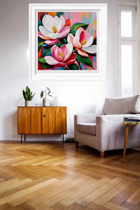 Pink magnolias with colourful background art print, framed in white hanging on wall