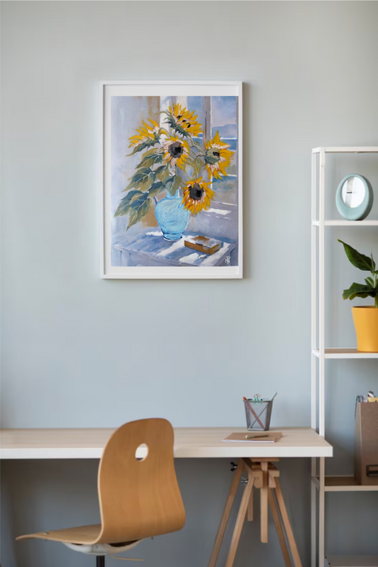 painting of yellow sunflowers in light blue vase sitting on a table near a window with sunshine streaming in hanging on a wall above a desk