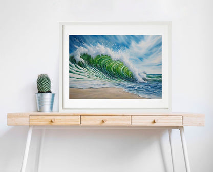 Beach, waves and blue sky art print. framed in white hanging on wall