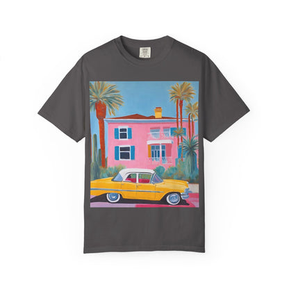 Grey t shirt printed on the front with a colourful palm springs pink house and a yellow vintage car and palm trees.