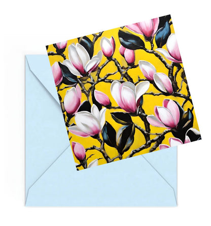 Mini art print of Pink and white Magnolia flowers on a Yellow background, on top of a Blue envelope.