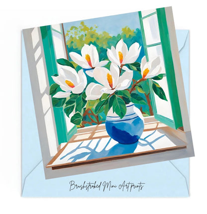 mini Art print of white Magnolia  flowers in a blue vase on a windowsill with an open window.