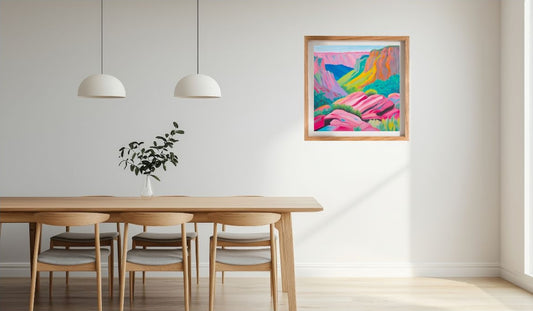 Dining room with a wooden table and chairs, colourful abstract  seascape painting on the wall, and two pendant lights.
