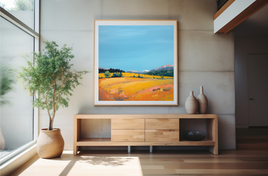 Modern interior with a wooden sideboard, decorative vases, and a framed landscape painting.