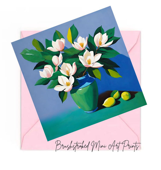 Mini art print of a pink magnolia floral arrangement with a blue vase, on a pink envelope, featuring the brand 'Brushstroked Mini Art Prints'.