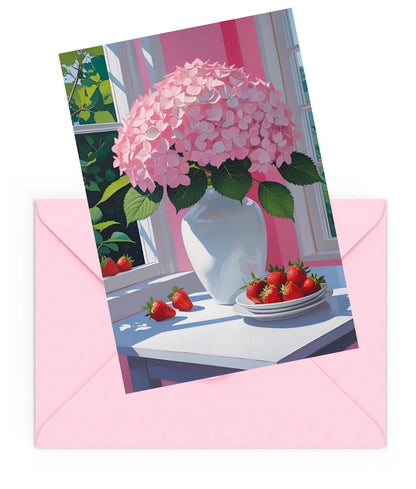 Mini art print of pink hydrangeas in white vase with strawberries, on top of a pink envelope.
