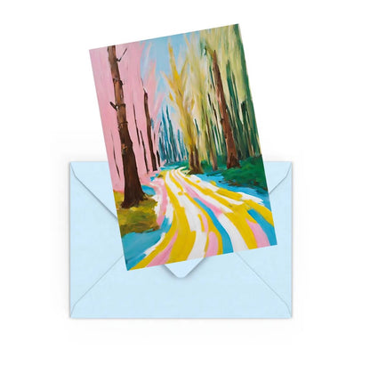 mini art print od a colourful abstract forest landscape, on top of a Blue envelope.