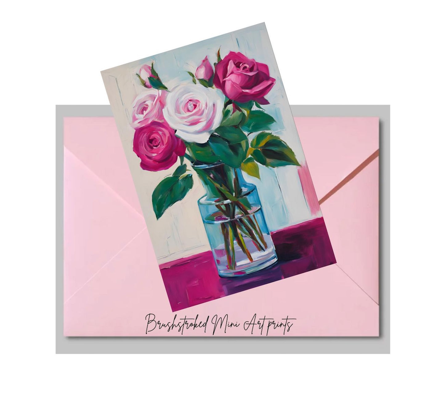 mini art print with a painting of pink and white roses in a glass vase on a pink envelope.
