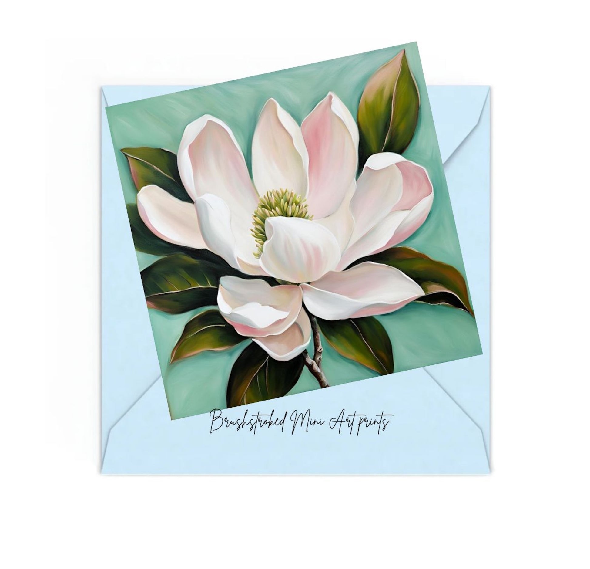 mini art print of a pink magnolia on top of a blue envelope