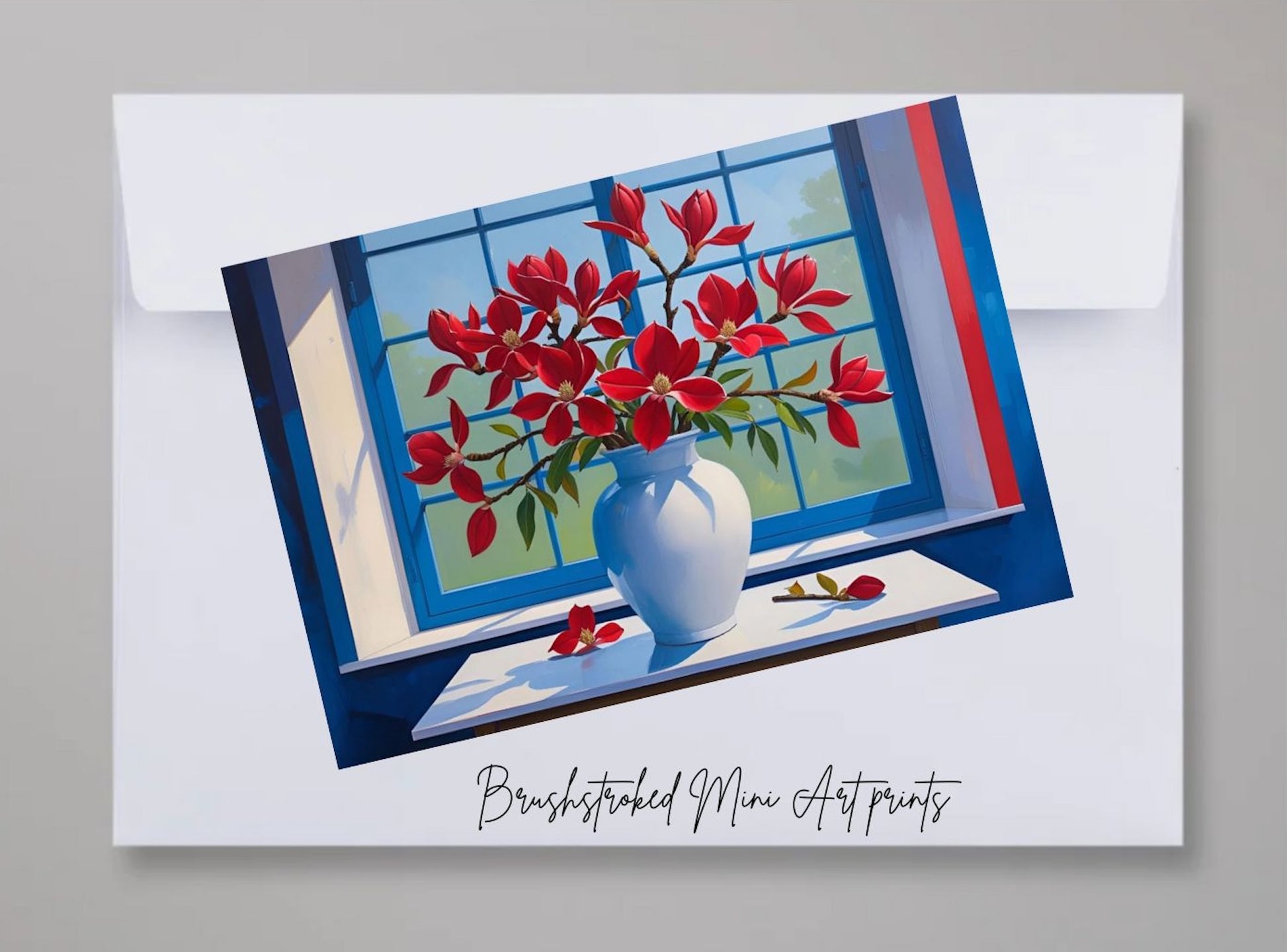 mini art print of red flowers in white vase near window